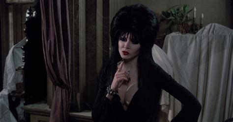 Still, never mind. Elvira's job—aside from keeping the scotch tape industry in business—was to introduce, interrupt, and snark at horror movies. She's a mix of punk, goth, and valley girl ...